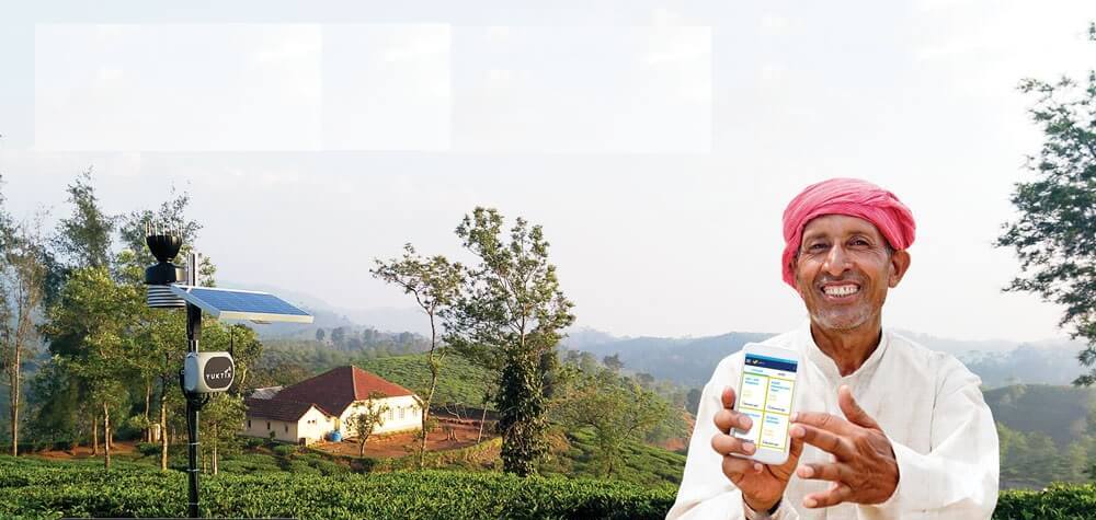 Happy farmer showing GidaBits app in his mobile phone